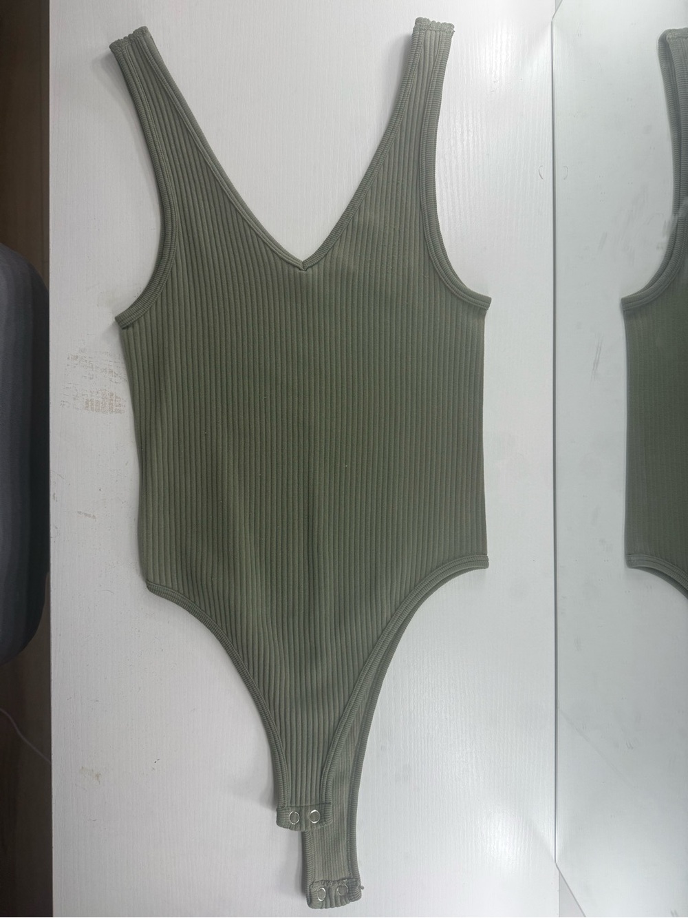 Woman’s Ribbed Olive Green One-Piece Bodysuit